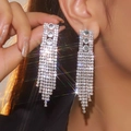 Elegant silver tassel earrings with sparkling rhinestones and long fringe on model - Silver Three Main Stones Vertical Multi-Row Tassel Earrings DTE1617083S-W
