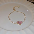 Close-up of pink heart cat-eye stone bracelet with gold plating and white zircon inlay - Pink Heart