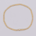 Pulsera artesanal con cuentas cilíndricas beige mate y esferas doradas pulidas - Cuentas Beige Mate Oro