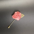 Macro shot of pink satin rose lapel pin with gold leaf and long needle on grey background - Deep Pink