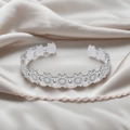 Elegant silver open bangle featuring a continuous daisy flower design on silk fabric - f34 Daisy Linked Style / Silver