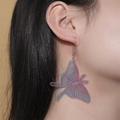 Translucent green butterfly moth wing drop earrings with pink vein details shown on model - Laser Butterfly Earrings (Translucent Pink-Green)
