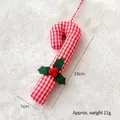 Red and white plaid Scottish candy cane ornament with red berries for Christmas trees - Grid Style