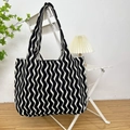 Knitted shoulder tote bag featuring a classic black and white wavy pattern in large size - Vertical Stripe Black