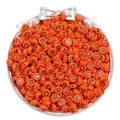 Orange acrylic round beads with black star and heart patterns in a decorative silver bowl - Orange-Red Stars Moons Beads