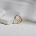 Minimalist gold open ring featuring small clear crystals on marble background - Gold Irregular Zirconia