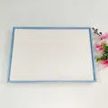 Detail view of large 100-slot jewelry display tray for rings and stud earrings - Blue + White Brushed Leather