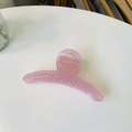 Elegant curved matte pink hair claw clip for women shown on a clean white surface - Jelly Pink