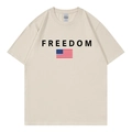 Beige cotton t-shirt with Freedom print and US flag, flat lay view on white background - Beige