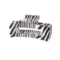 Dettaglio della grande molletta rettangolare per capelli con trama zebrata bianca e nera - Zebra Print