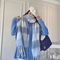 Blue and white gradient checkered long scarf with tassels shown on a model - No.16 Blue White Plaid