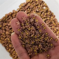 Close-up of matte resin brown flower charms with yellow center for 3D nail art and DIY craft - Brown