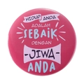 Pink tinplate badge with Indonesian text and ribbon design on a white background - HIDUP ANDA ADALAH SEBAIK
