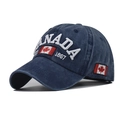 Close-up of vintage blue CANADA baseball cap with 1867 embroidery and maple leaf detail - Adjustable / Washed Navy