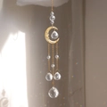 Detail of crystal moon wind chime reflecting rainbow prisms against soft sunlight - N1-Gold Face Moon-Clear Crystal Balls Set