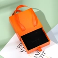 Orange drawer jewelry gift box with matching silk ribbon handle and black velvet interior - Orange