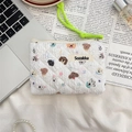 Quilted fabric pouch with puppy and star prints featuring a lime green rope zipper pull - Star Dog