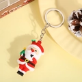 Cartoon Santa Claus PVC keychain holding a mini tree with silver ring and chain link - Kissing Santa (Silver Keychain)