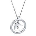 Macro detail of round pendant with heart cutout and laser engraved letter M in silver - M