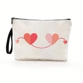 White canvas heart makeup bag with red and pink heart patterns and black zipper strap - Style 2