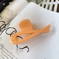 Detail of a large apricot hair claw clip on a stylish magazine background - Butterfly Buckle Ribbon (Approx 12cm) / Bright Orange