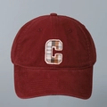 Close-up of letter C embroidery with plaid pattern on a dark red cotton baseball cap - Dark Red