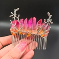 Macro detail of natural pink crystal stones on a silver metal branch hair comb accessory - Red Orange + Branch