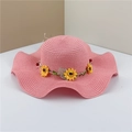 Pink wide brim straw sun hat with sunflower band and wavy edge for summer beach vacations - Pink
