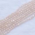 Macro shot of 4x5mm strawberry faceted crystal beads with iridescent shimmer for DIY jewelry - 4*5mm (Approx 95pcs/strand) / Pink Jade AB