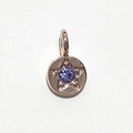 Rose gold round pendant with a blue-purple gemstone and engraved star patterns - Rose Gold June