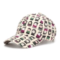 Détail de la casquette de baseball en coton avec des imprimés de personnages colorés - Taille unique / Blanc Cassé