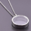 Macro shot of a silver stainless steel floating locket pendant with glass and metal chain - Inner Diameter 20mm / Steel