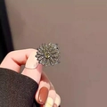 Floral crystal hair claw with yellow center stone and silver base in a hand-held view - 2# Daisy Mini Hair Claw (Approx. 2.1CM)