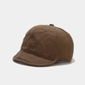 Detail view of brown cotton twill baseball cap with short brim and six-panel construction - Adjustable / Tan