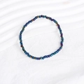 Detailed close-up of bohemian beaded bracelet featuring metallic blue and purple beads - Metallic Rainbow