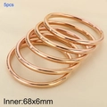5pcs set of 18k rose gold plated titanium steel 6mm hollow bangles on beige background - Rose Gold Set (5 Rings)