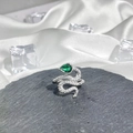 Macro shot of silver snake ring featuring green pear-cut stone and white pavé crystals - Style 14 Adjustable Ring
