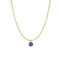 Golden necklace with round blue birthstone pendant in classic four-prong setting - December