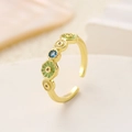 Close-up of golden adjustable ring featuring blue gemstone and green enamel flowers - Light Green Enamel Flower Zirconia Ring (Light KC Gold Flower 4062)