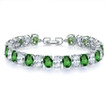 Macro view of silver bracelet with green and white oval crystals and fold-over clasp - Platinum Green Zirconia (068)