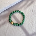 Elegant beaded ring with natural malachite green stones and a gold accent bead - Elastic Free Size / Malachite Green