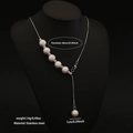 Long Y-shaped stainless steel necklace with white faux pearls on a black mannequin - Multi-Pearl Y-Shape Style (4#)