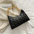 Retro black quilted underarm bag with gold chain strap on white fabric background - Black