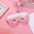 Pink plush unicorn sleep mask with silver horn on decorative aesthetic background - Fringe Unicorn with Silver Horn