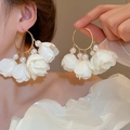 Detail of floral tassel hoop earrings with white petals and pearls on gold rings - 54# Silver Needle - White