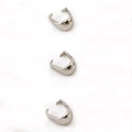 Macro detail of three silver stainless steel pinch bails for DIY jewelry making - 4*7mm (100Pcs) / Steel Color