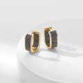 Elegant gold U-shaped hoop earrings with micro-paved blue zircons on white pedestal - Gold With Dark Blue Zirconia