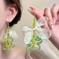 Detail of beaded flower earrings featuring a white fabric bow and soft green beads - Light Green Beaded Flower with White Bow (4# Earring Hook - Green)