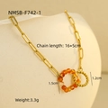 Detail of linked orange faceted bead ring and twisted gold circle on stainless bracelet - Natural Stone Ring Bracelet (NMSB-F742-1) / Gold Orange