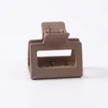 Close-up of matte light brown rectangular claw clip with metal spring opening detail - Light Coffee